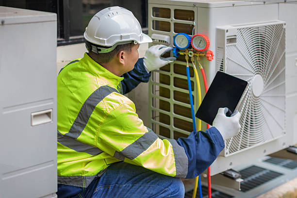 Professional Heat Pump Repair technician working in Grand Bay, AL